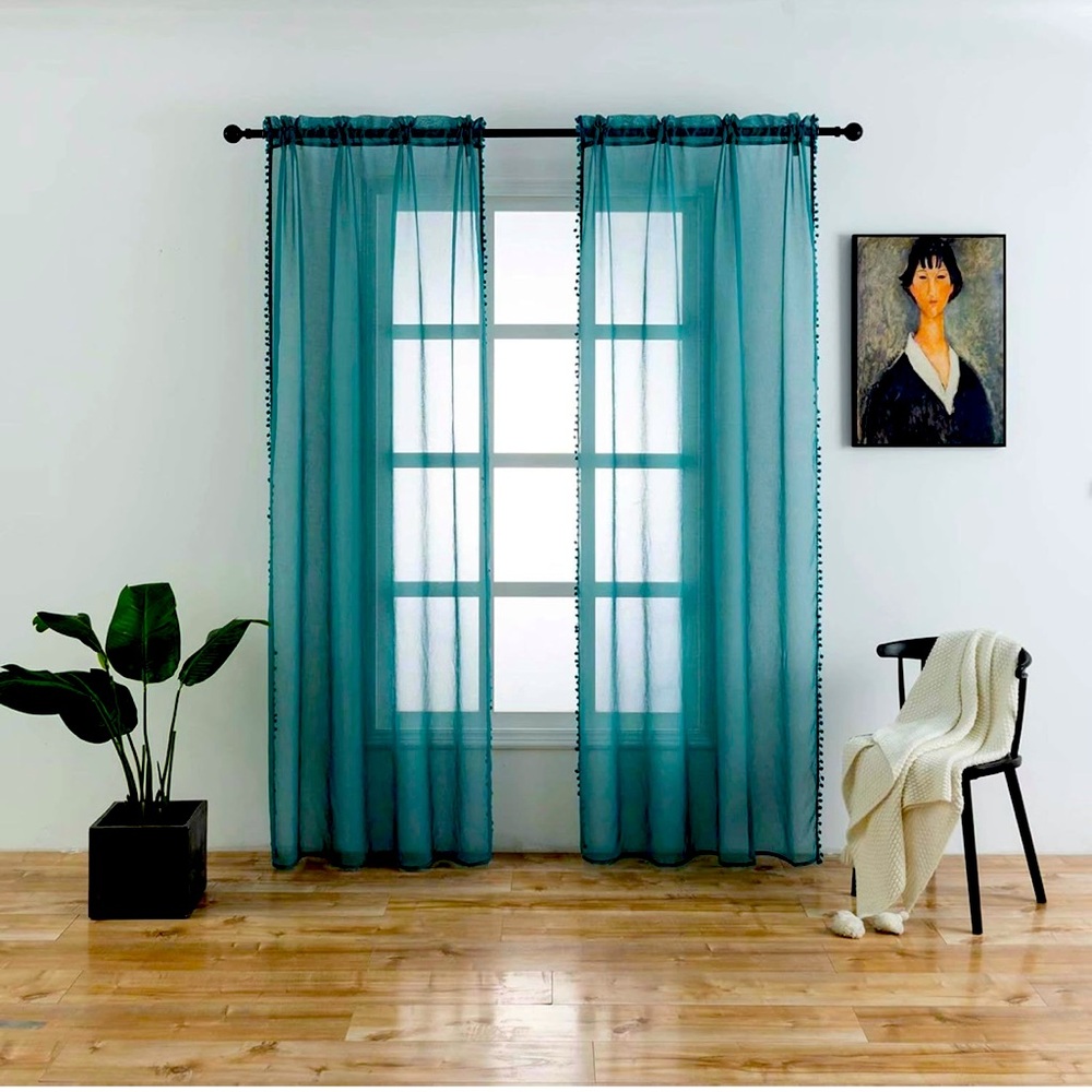 Cute sheer pom-pom curtains in teal